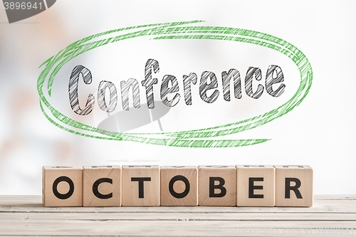 Image of October conference sign made of wood