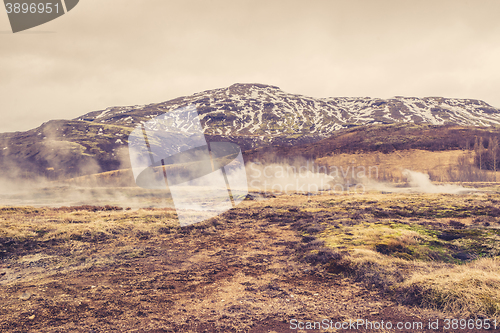 Image of Misty landscape in front of a mountain