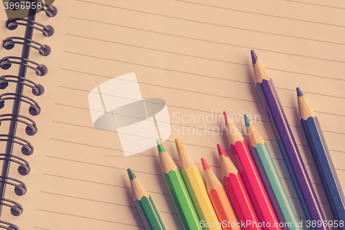 Image of Colorful pencils on linear paper