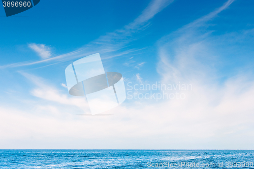 Image of White skies over the blue ocean