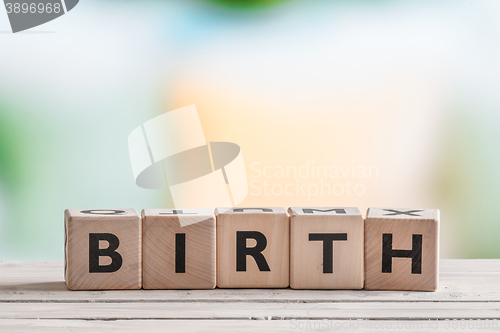 Image of Birth sign on wooden blocks