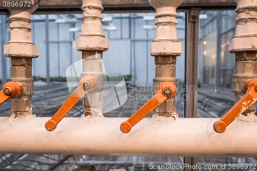 Image of Factory pipes with handles