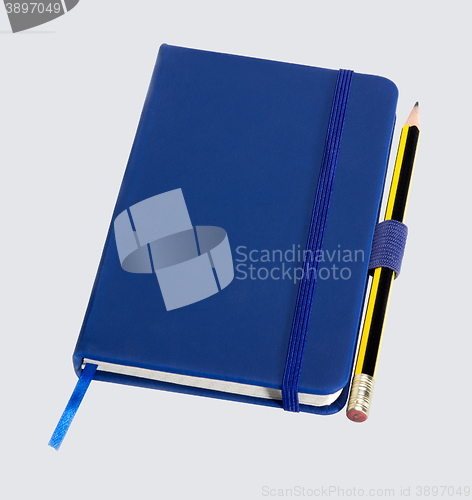 Image of blue notebook and pencil