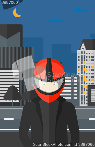 Image of Man in biker helmet.