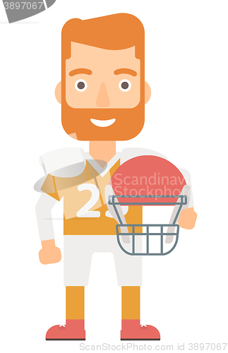 Image of Rugby player with ball and helmet in hands.