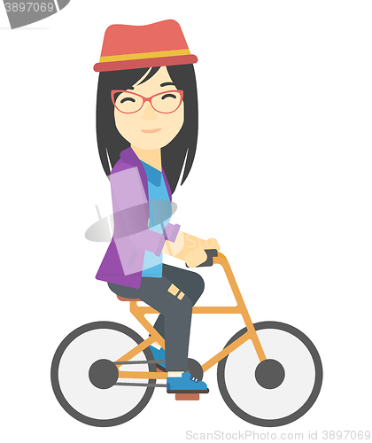 Image of Woman cycling to work.