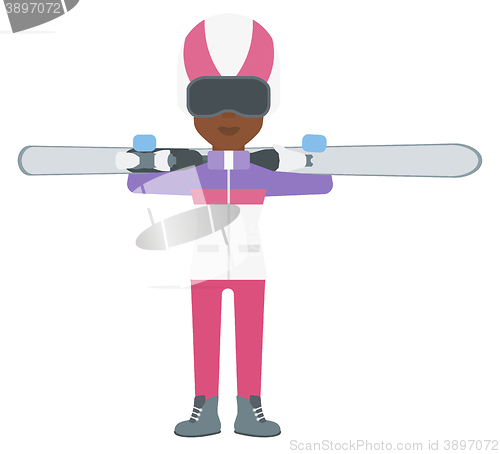 Image of Woman holding skis.