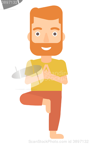 Image of Man practicing yoga.