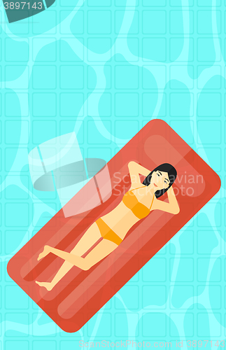 Image of Woman relaxing in swimming pool.