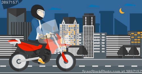 Image of Woman riding motorcycle.