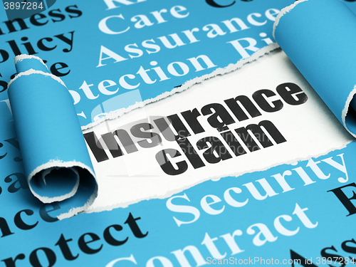 Image of Insurance concept: black text Insurance Claim under the piece of  torn paper