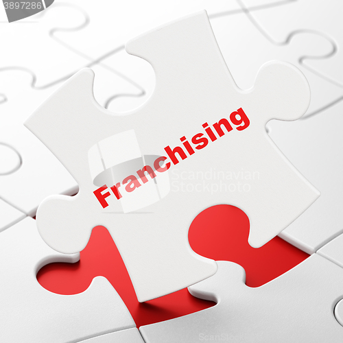 Image of Business concept: Franchising on puzzle background