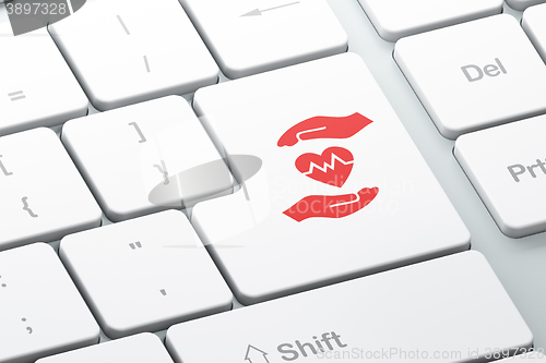 Image of Insurance concept: Heart And Palm on computer keyboard background