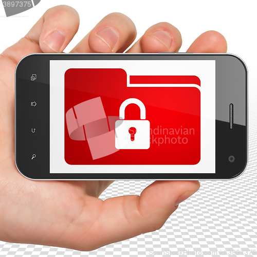 Image of Finance concept: Hand Holding Smartphone with Folder With Lock on display