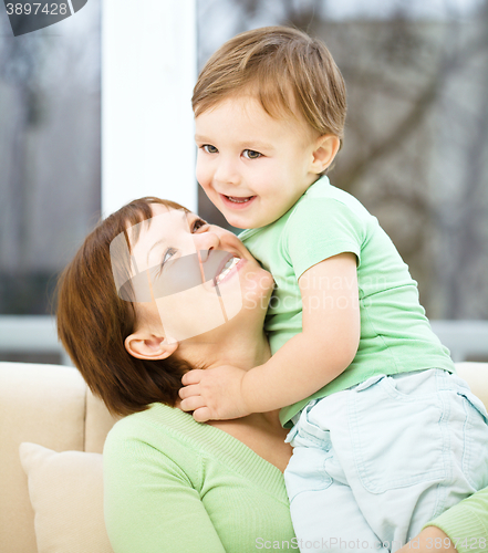 Image of Mother is having fun with her son