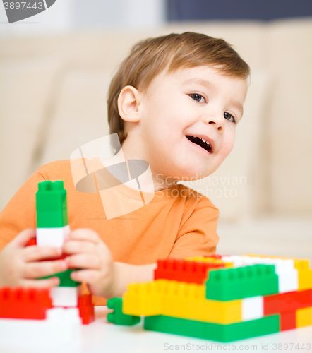 Image of Boy is playing with building blocks