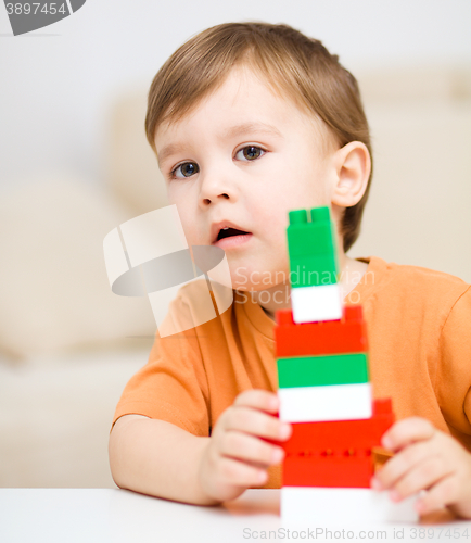 Image of Boy is playing with building blocks