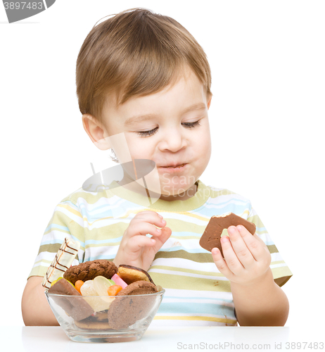 Image of Portrait of a boy with cookies