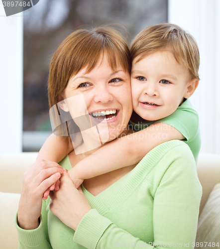 Image of Mother is having fun with her son