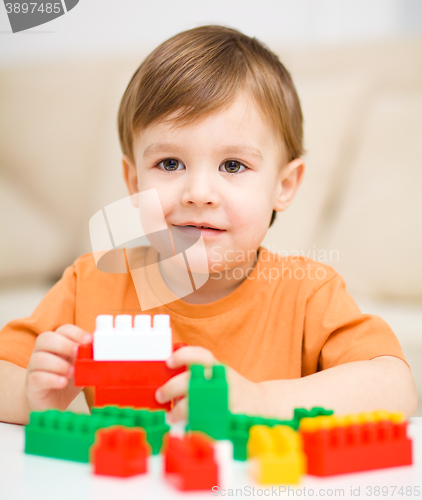 Image of Boy is playing with building blocks