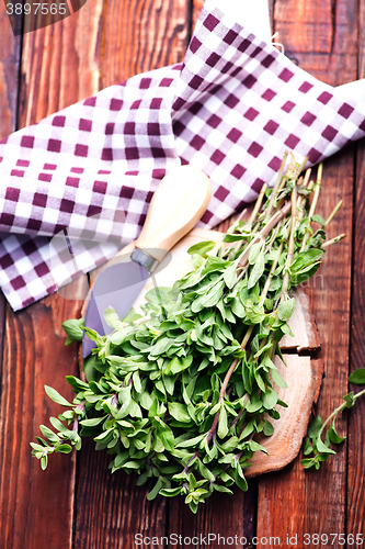 Image of marjoram on a wooden rustic table