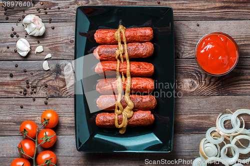 Image of Sausage roasted on the grill.