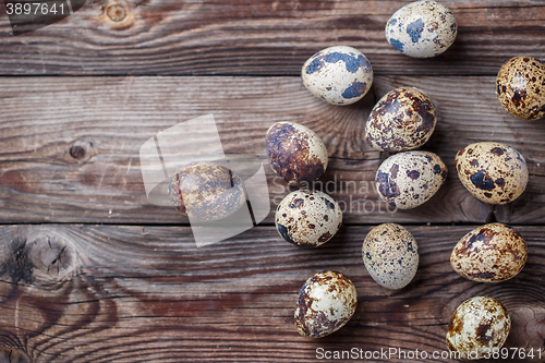 Image of Group of quail eggs on thewooden background