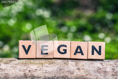 Image of Vegan label on a tree log