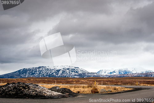 Image of Cloudy weather by a road