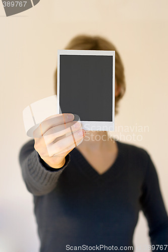 Image of woman holding empty card in front