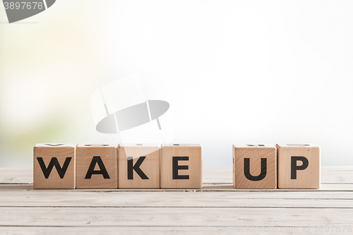 Image of Wake up sign with wooden cubes