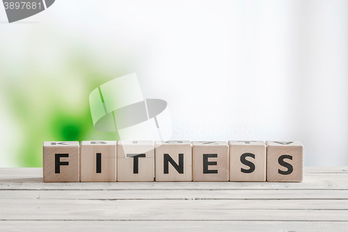 Image of Fitness word on a wooden table