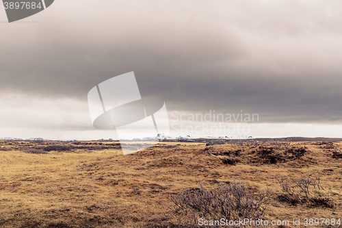 Image of Dark clouds over a landscape in Iceland