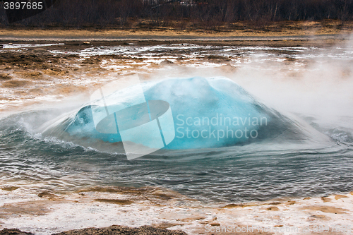 Image of Strokkur geyser in Iceland about to erupt