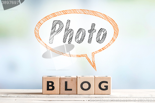 Image of Photography blogger sign on a table