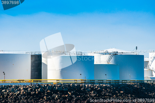 Image of Silos by the sea in blue sky