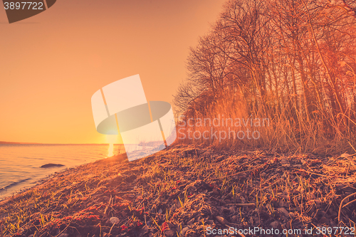Image of Morning sunrise by a large lake