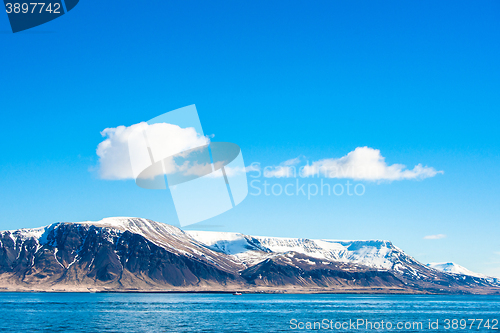 Image of Skies over a mountain in the ocean