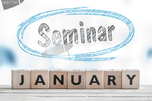 Image of January seminar sign on a table