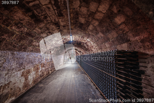 Image of Long underground brick tunnel in the wine cellar