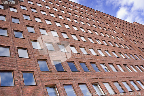 Image of Front of a Brick building and a nice blue sky
