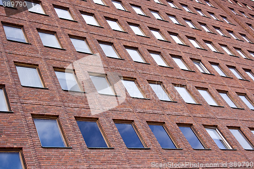 Image of Front of a Brick building and a nice blue sky