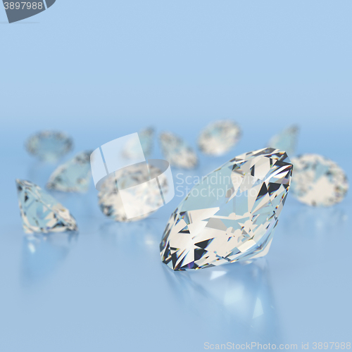 Image of Shiny white diamonds on blue background. 