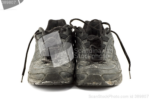 Image of Old grungy Running Shoes isolated on white background