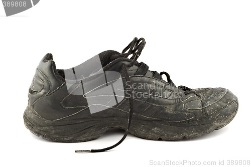 Image of Old grungy Running Shoes isolated on white background