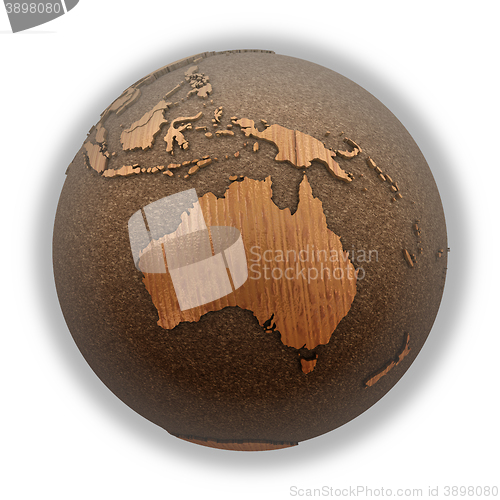 Image of Australia on wooden planet Earth