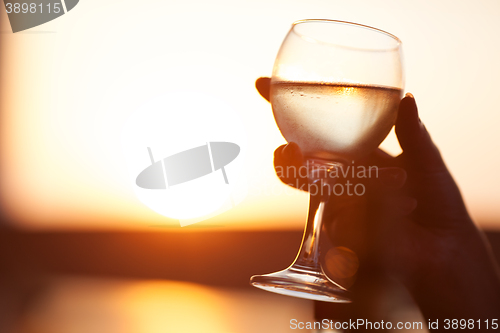 Image of Close-up of hand holding glass of drink