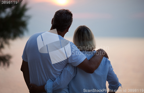 Image of Romantic couple enjoying the sunset