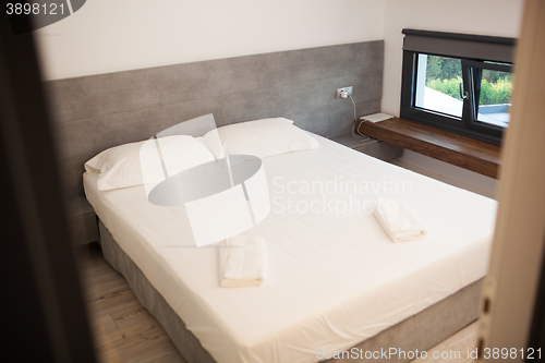 Image of Empty hotel room for two with matrimonial bed