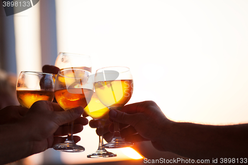 Image of Group of people toasting at a celebration party